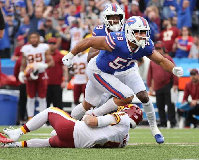 Buffalo Bills linebacker Matt Milano tackles Washington quarterback Taylor Heinicke.